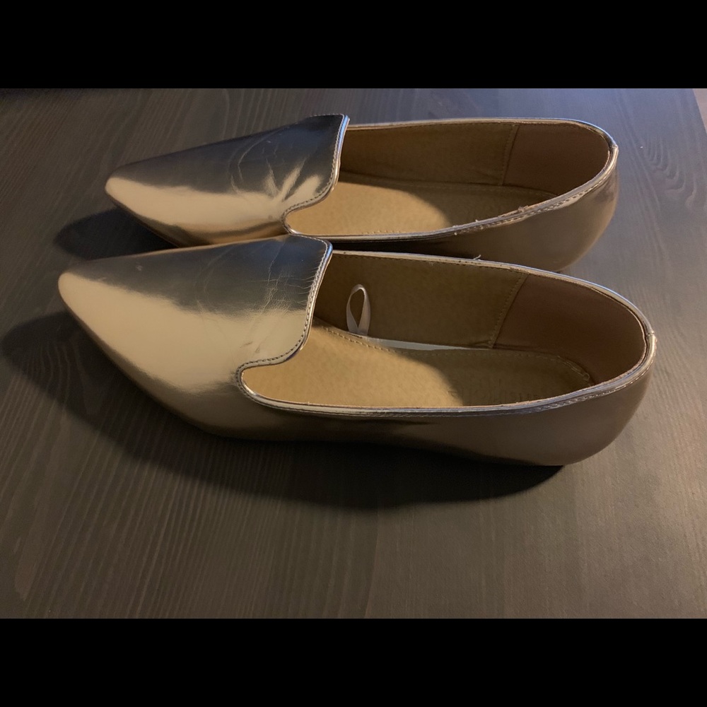 Pointed gold loafers.